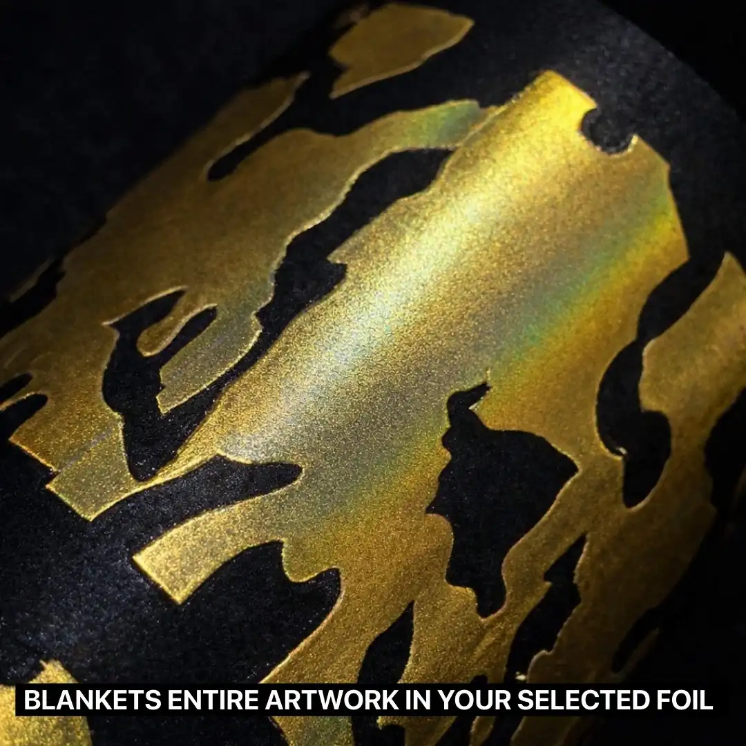 Close-up of a black fabric featuring a gold metallic foil DTF print, showing a smooth, reflective finish that fully covers the artwork with a premium shine.
